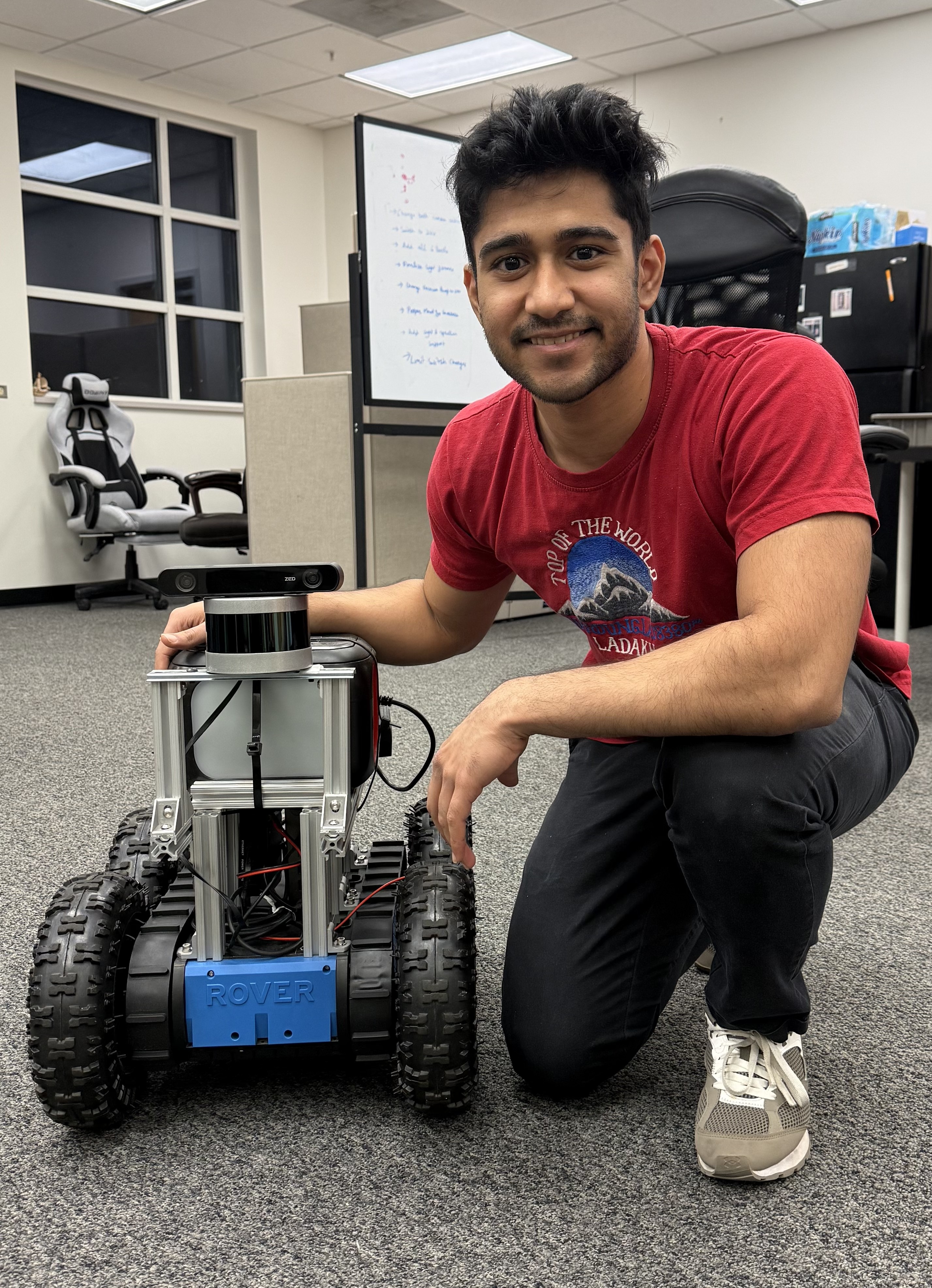 Manas Desai with robot